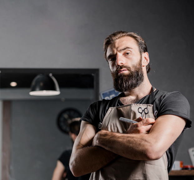 Portrait of a barber with folded arms